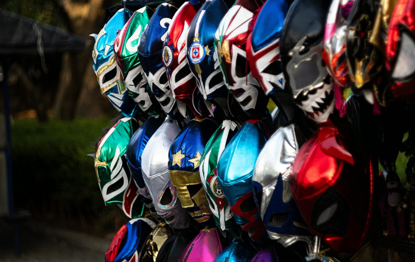 Multicolored lucha libre masks on display in Mexico City, showcasing vibrant Mexican culture.